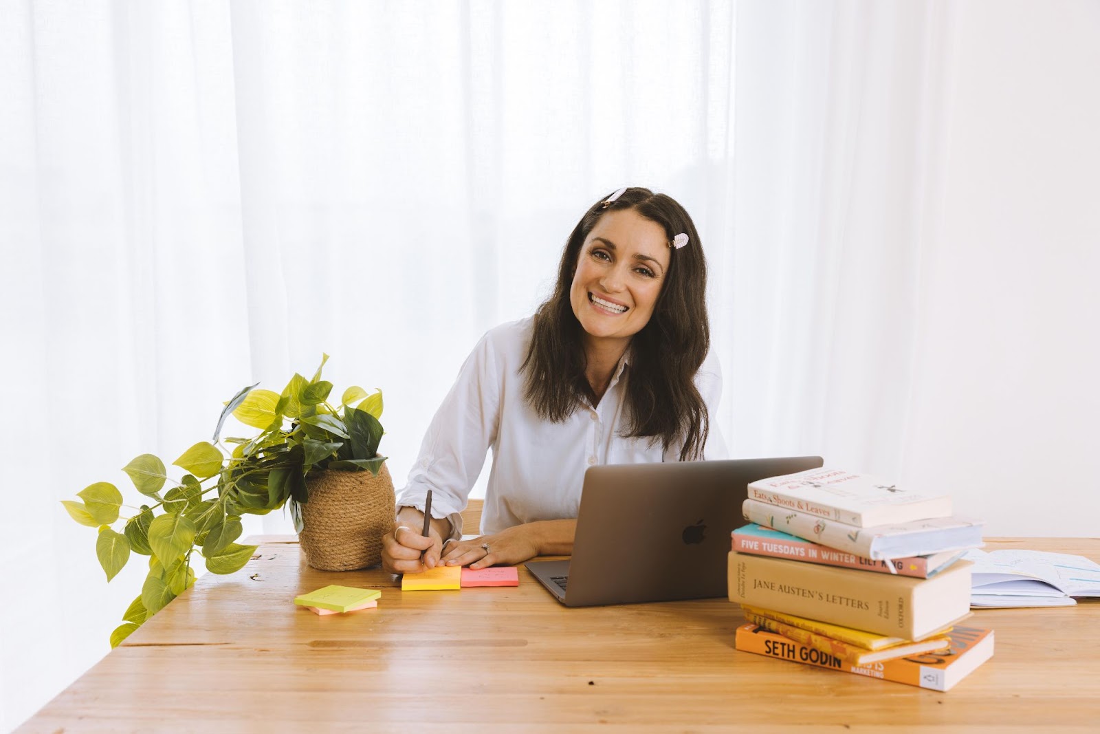 Marisa Twentyman at her desk writing copywriting blog and courses